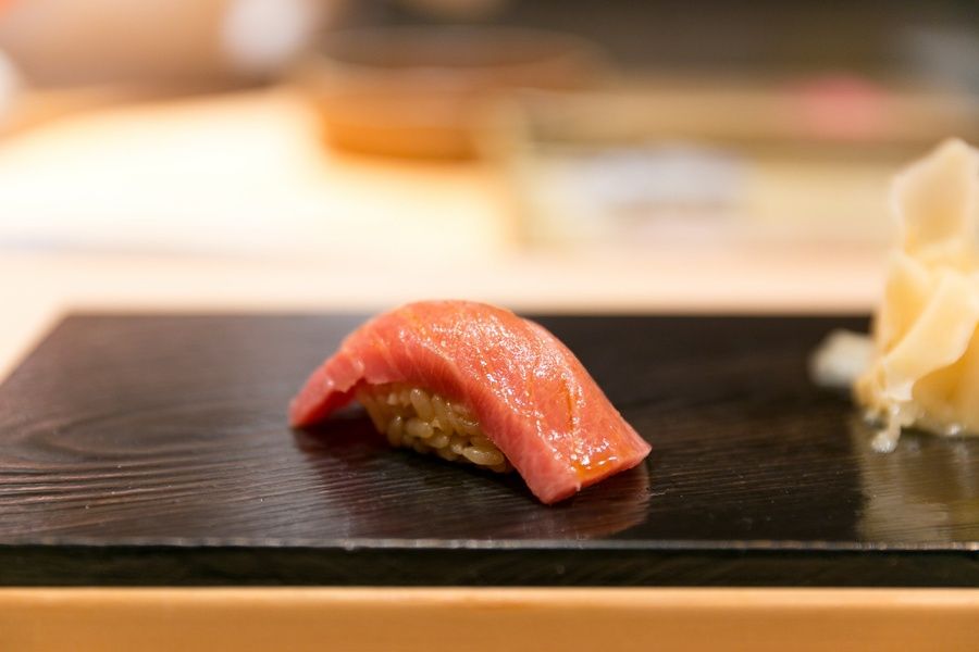 Eating Otoro sushi during your luxury travel to Japan