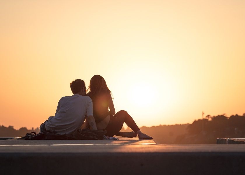 Couple watching sunset during their Puerto Rico honeymoon