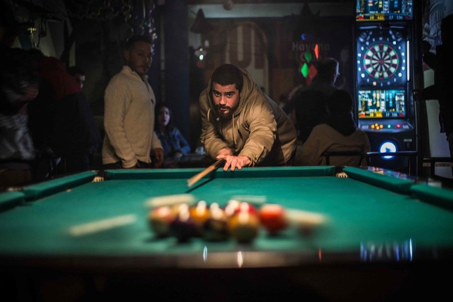 local cuban playing pool at a bar in cuba