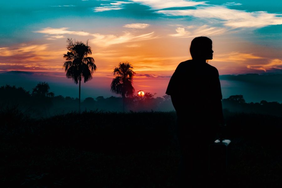 girl looks at sunset in colombia