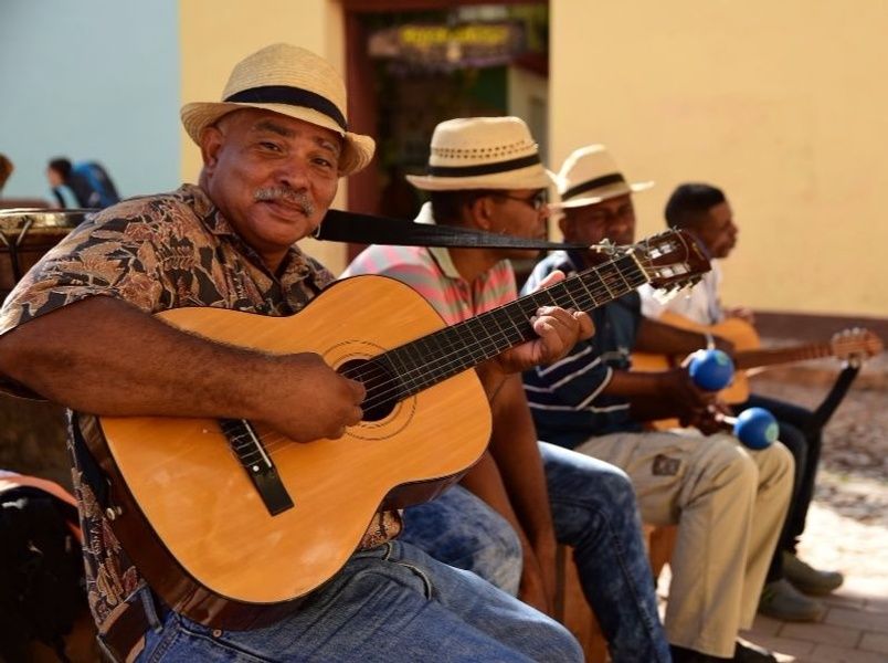 Cuban men playing guitar culture