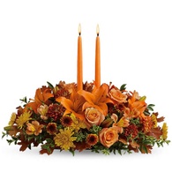 Thanksgiving flowers centerpieces orange lily and candle flowers centerpiece