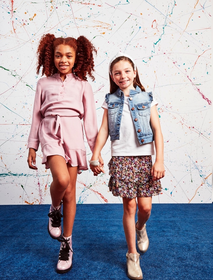 two girls in kids subscription clothes