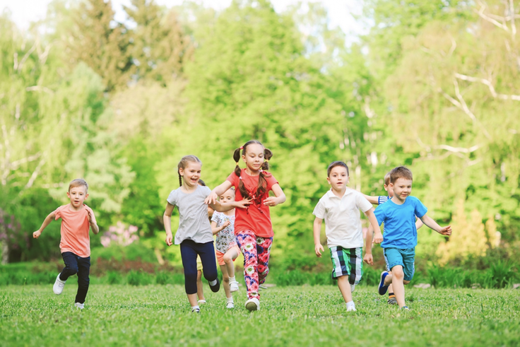 Children running through a field