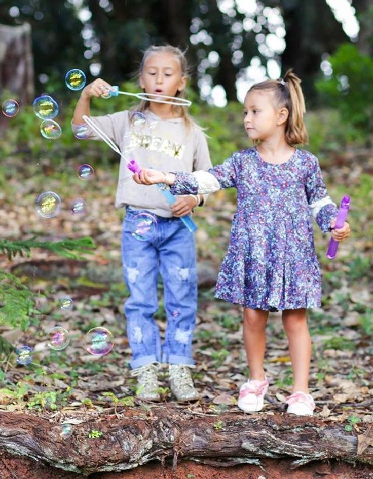 Girls blowing bubbles