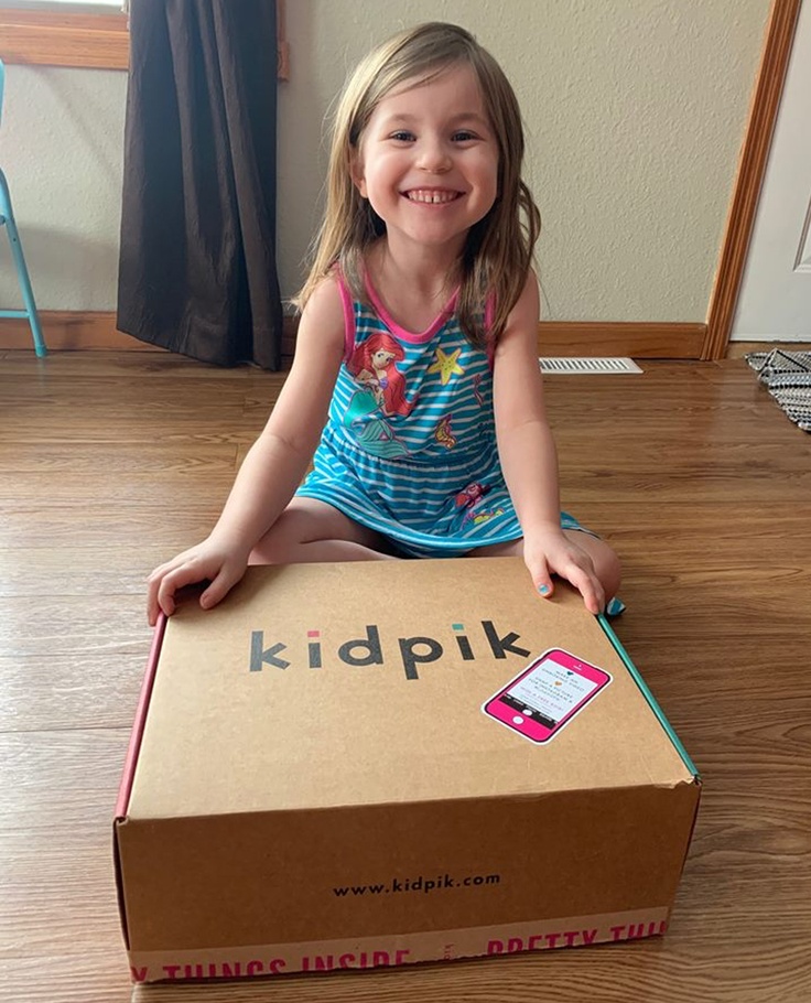 girl with kidpik subscription box