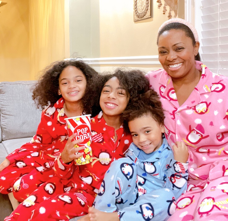 Family smiling in kidpik pajamas