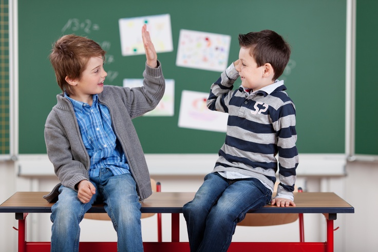 two kids high fiving