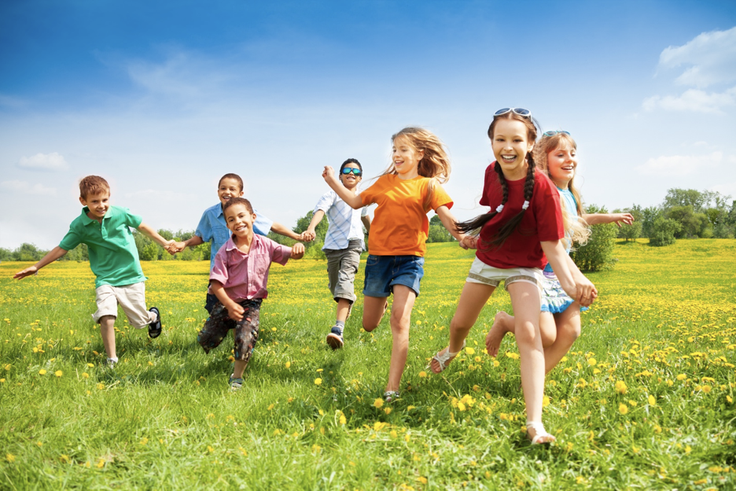 Children running through a field