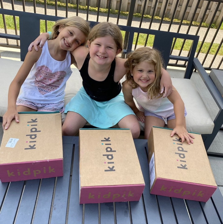 3 girls and 3 kidpik clothing boxes