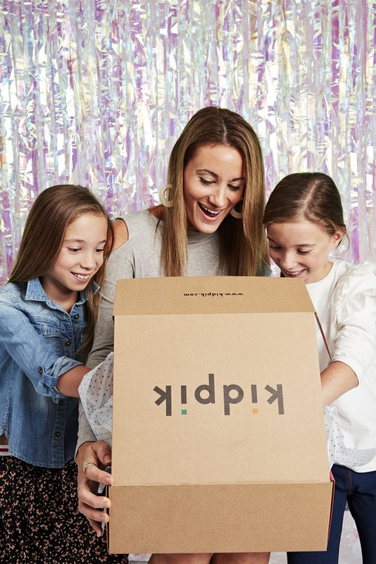 Mom and 2 girls opening fashion subscription box