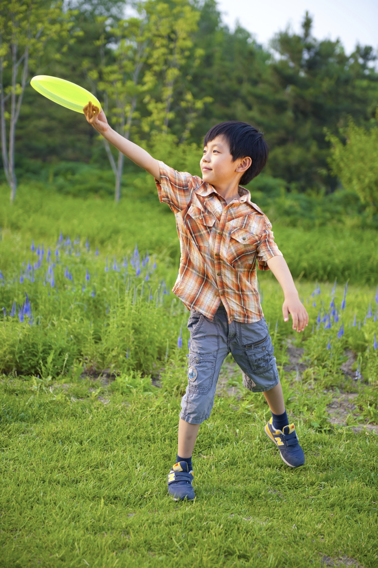 Boy catching frisbee