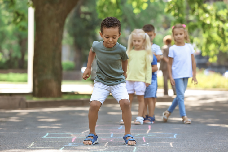 Kids playing hop scotch