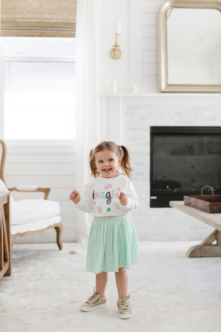 Girl laughing in kidpik clothes