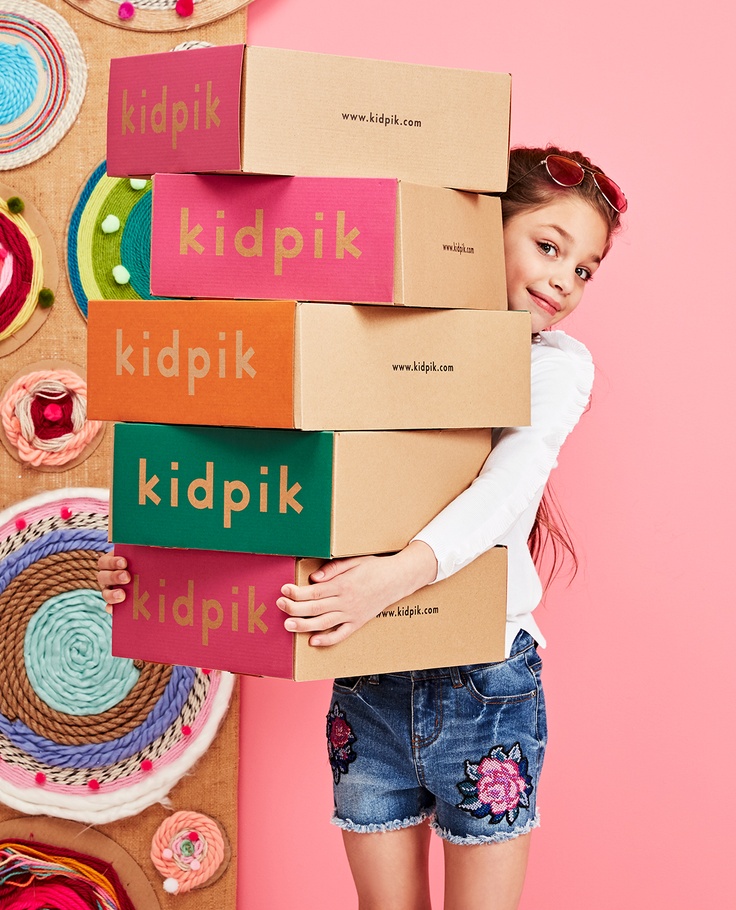 Girl holding kidpik box