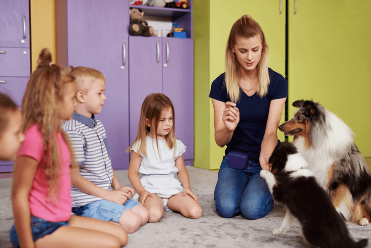 kids and dogs in circle together