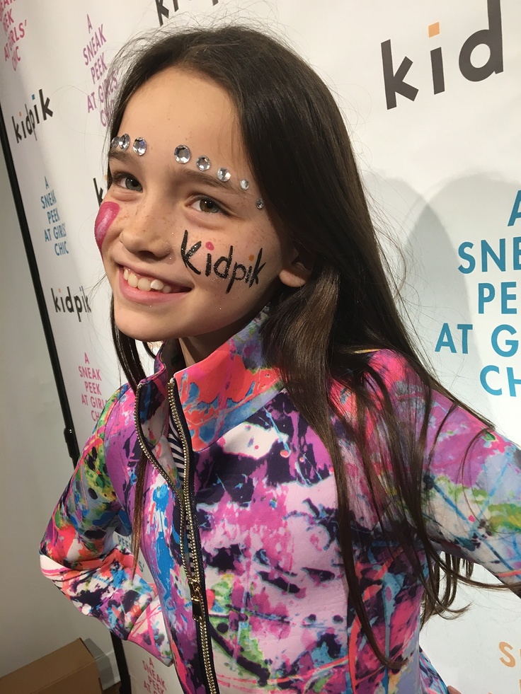 girl with kidpik written on her face