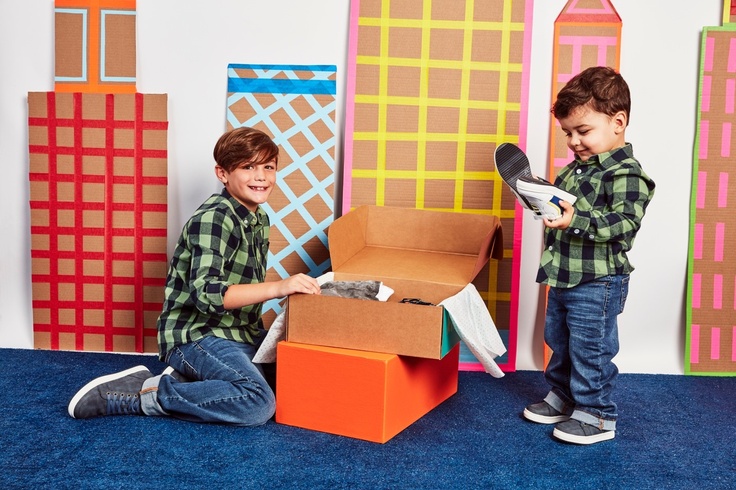 two boys in subscription box clothes