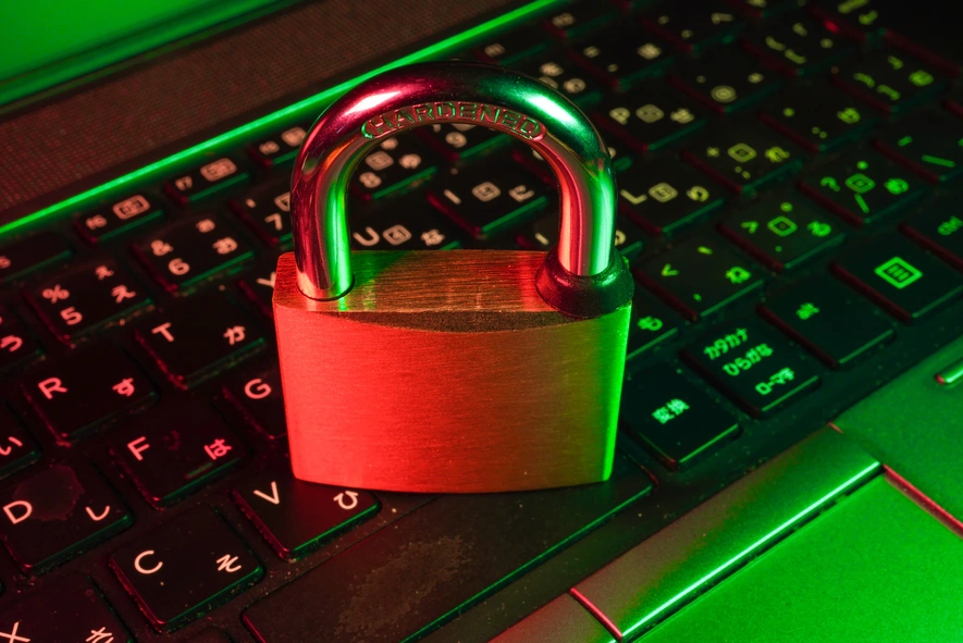 A padlock sits on a computer keyboard, indicating the importance of DevSecOps.